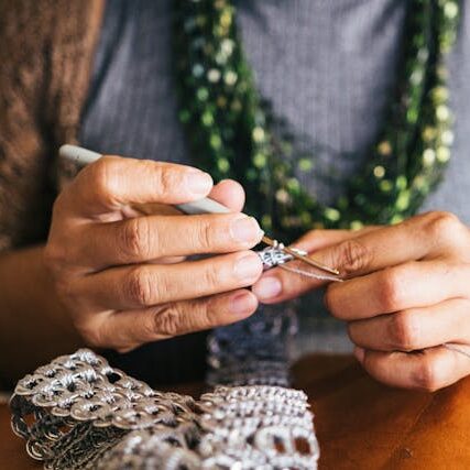 image of a person's hands knitting