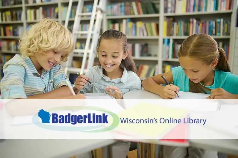 kids drawing and writing in the library